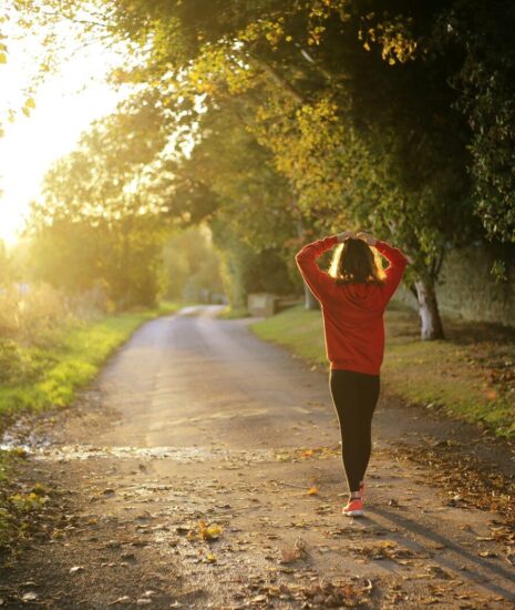 woman walking on pathway during daytime